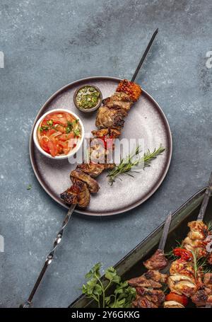 Food, Bbq grilled meat pork and vegetable skewers on gray plate, Top view, flat lay Stock Photo