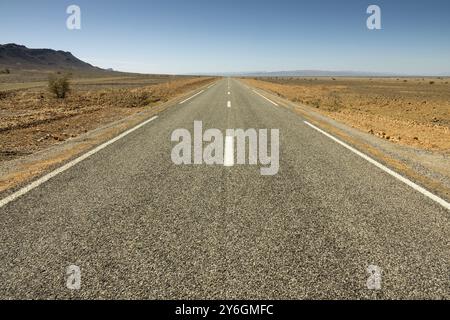 Asphalt road in a rocky desert, Morocco, Africa Stock Photo