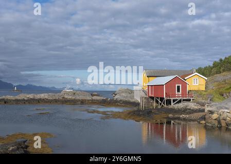 Traditional fishermen's houses, called rorbuer, on the rocky coast of the Vestfjord, Sorvagen, Lofoten, Norway, Europe Stock Photo