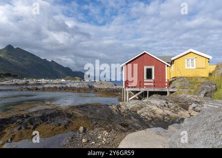 Traditional fishermen's houses, called rorbuer, on the rocky coast of the Vestfjord, Sorvagen, Lofoten, Norway, Europe Stock Photo