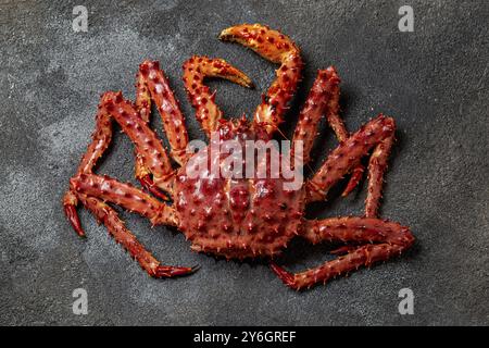 Food, Food, Red king crab on gray background. King crab, lemon and cilantro, top view Stock Photo