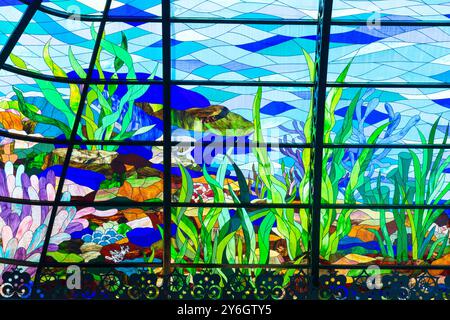 Close-up of a stained glass window of the fish market at the Mina District in Doha, Qatar Stock Photo