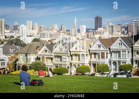 San Francisco, California, United States, November 2013: View on the Painted Ladies Victorian houses of San Francisco with cityscape and skyline in th Stock Photo