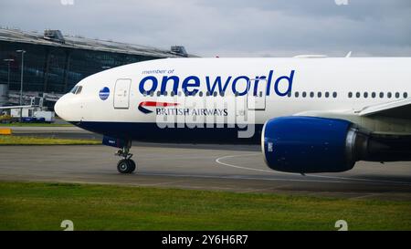 Hounslow, UK - September 22, 2024; British Airways Boeing 777 200 passenger aircraft with One World branding Stock Photo