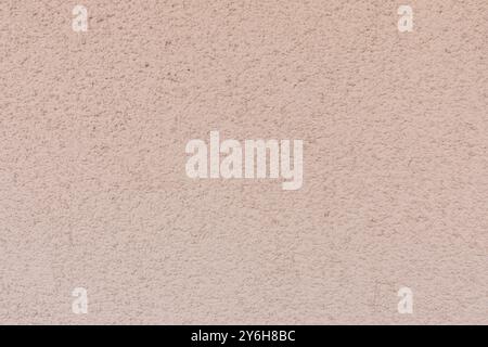 Light Pink Textured Wall Background Perfect for Digital Design and Creative Projects. Stock Photo