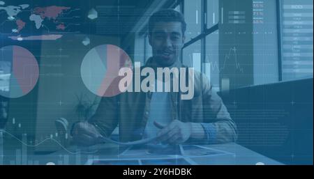 Image of diagrams and data processing over biracial businessman having image call Stock Photo