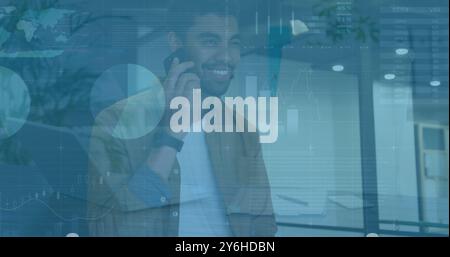 Image of diagrams and data processing over biracial businessman using smartphone Stock Photo