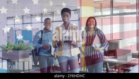 Image of flag of usa over happy diverse businesspeople in office Stock Photo
