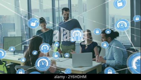 Image of network of connections with padlock icons over diverse business people in office Stock Photo