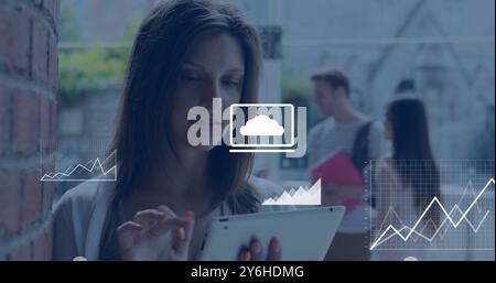 Image of data media icons over happy caucasian woman using tablet at college Stock Photo