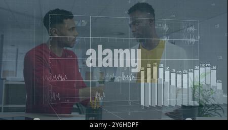 Image of financial data processing over diverse business people in office Stock Photo