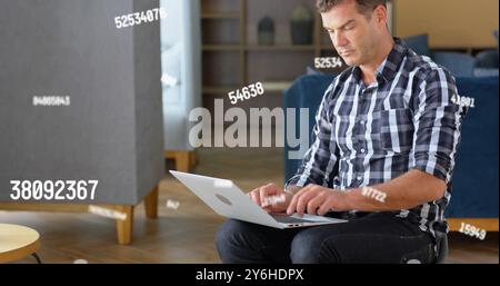 Image of data processing over caucasian businessman using laptop in office Stock Photo