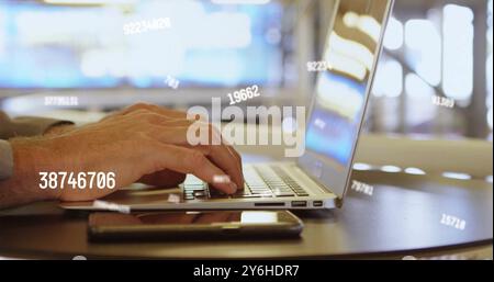 Image of data processing over caucasian businessman using laptop in office Stock Photo