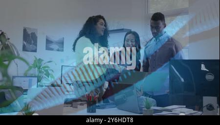 Image of dna strand over diverse business people in office Stock Photo