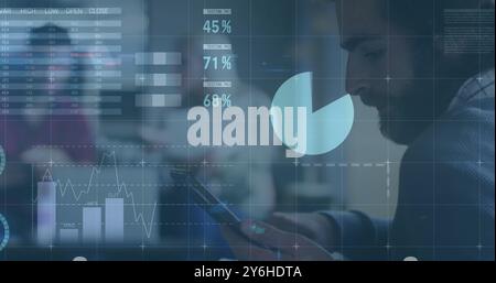 Image of financial data processing over caucasian businessman in office Stock Photo