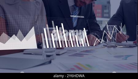 Image of financial data processing over diverse business people in office Stock Photo