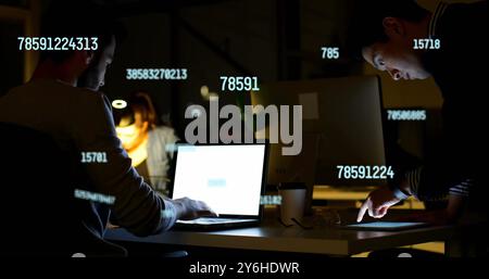 Image of data processing over diverse collleagues working in office Stock Photo