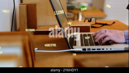 Image of data processing over caucasian businessman using laptop in office Stock Photo