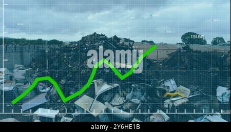 Green line graph image over large pile of electronic waste in recycling yard Stock Photo