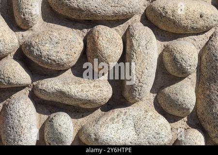 a wall of round stones of various sizes Stock Photo