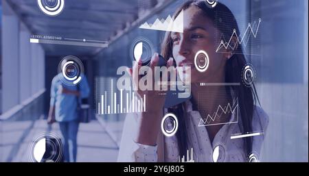Image of data processing over biracial businesswoman using smartphone in airport Stock Photo