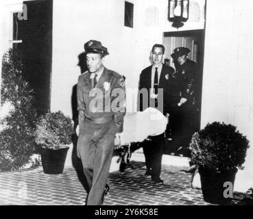 Beverly Hills , California USA  Johnny Stompanato stabbed to death by 14 years old Daughter Cheryl Crane of Lana Turner .  Crane has been charged with suspicion of murder.  Body of Stomapanto carried out of Actress Lana Turners home .  1958 Stock Photo