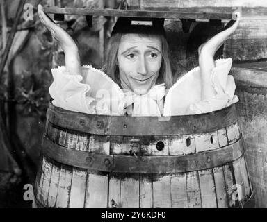 John Neville as Sir Andrew Aguecheek pops up out of his barrel in the Old Vic production of Shakespeare's Twelfth Night at the Assembly Hall in Edinburgh.  This production has won an instant welcome to the Edinburgh Festival.  28th August 1958 ©TopFoto Stock Photo