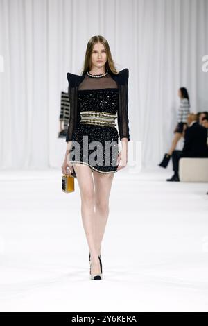 Paris, France. 26th Sep, 2024. A model presents a creation from the Spring/Summer 2025 ready-to-wear collections by Balmain during the Paris Fashion Week, in Paris, France, Sept. 25, 2024. Credit: Xinhua/Alamy Live News Stock Photo