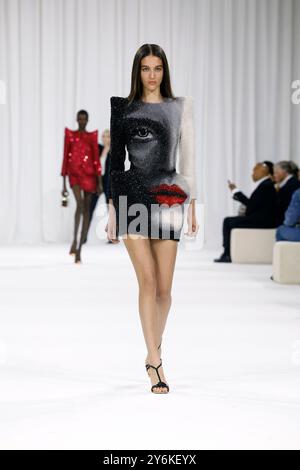 Paris, France. 26th Sep, 2024. A model presents a creation from the Spring/Summer 2025 ready-to-wear collections by Balmain during the Paris Fashion Week, in Paris, France, Sept. 25, 2024. Credit: Xinhua/Alamy Live News Stock Photo