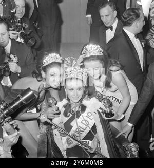 London:  Madeleine Hartog-Bel (Peru) being congratualated by Miss Guyana, Shakira Baksh, who was third - on left - Miss Argentina, Maria Sapaliauskas, who was second, after her victory in the Miss World 1967 Beauty Contest at the lyceum Ballroom, London.  16 November 1967 Stock Photo