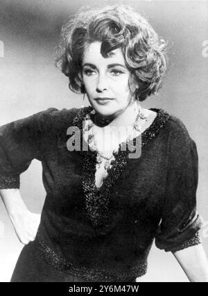 This haggard-looking middle-aged women is none other than actress Elizabeth Taylor as she appears in the main role in Edward Albee's controversial Broadway drama: 'Who's Afraid of Virginia Woolf.' The usually glamorous Miss Taylor had her hair streaked with grey and the lines of her face accentuated for the role of a loud-mouthed campus wife. She co stars with her husband, Richard Burton.  January 1966 Stock Photo