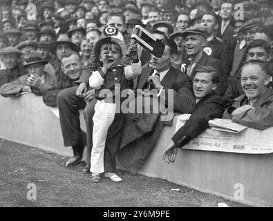 A young Arsenal supporter exercising his lungs on behalf of his team at the London Derby between Arsenal and Tottenham Hotspur at Highbury  October 20th 1934 Stock Photo