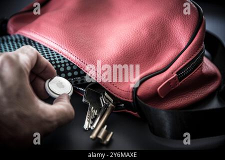 Airtag, Apple tracker, to find lost objects thanks to localization, but also used to spy on people Stock Photo
