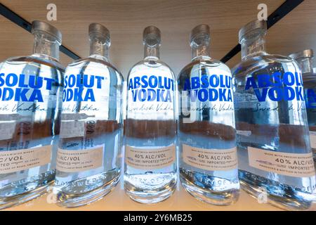 Bottles of vodka on a supermarket shelf. Absolut vodka Stock Photo