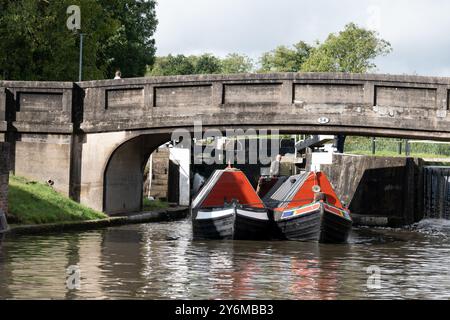 Narrowboats Trout and Norah at Hatton Locks, Grand Union Canal, Warwickshire, UK Stock Photo