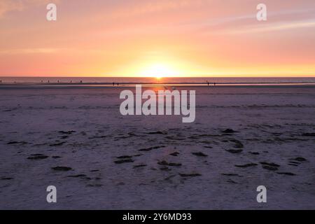 Beautiful sunset  on the extensive sandy beach of Sankt Peter Ording Stock Photo