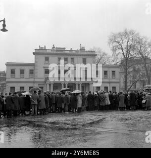 A crowd gathers outside the Spanish Embassy in London's Belgrave Square in silent protest against the execution of the Spanish communist leader Julian Grimau.  Grimau was eexecuted after being sentenced to death by a Madrid military tribunal on charges of 'Military treason' and other crimes committed during the Spanish Civil War. 20th April 1963 Stock Photo