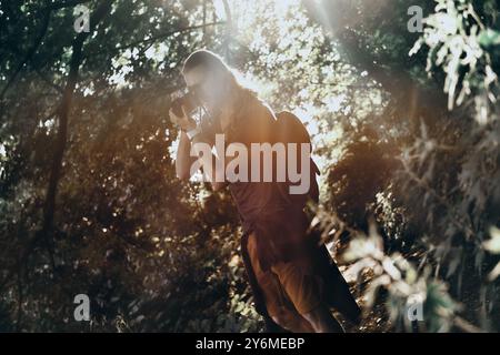 In the amazing place. Young man in casual clothing photographing something while standing outdoors Stock Photo