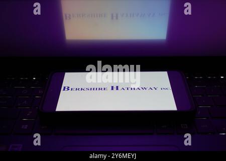 China. 26th Sep, 2024. In this photo illustration, Berkshire Hathaway logo is displayed on a smartphone with a laptop keyboard background. Credit: SOPA Images Limited/Alamy Live News Stock Photo