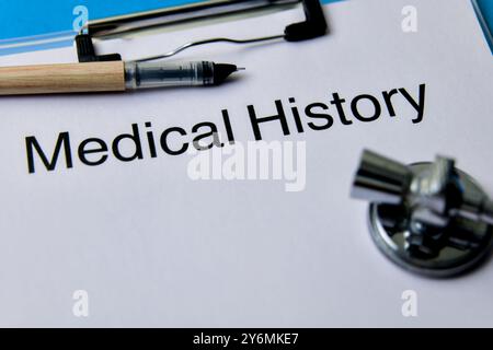 Close-up of a medical history form with pen and stethoscope, highlighting the importance of health records. Stock Photo