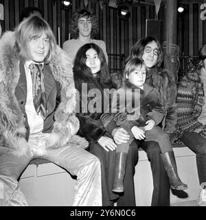 Watching rehearsals for Rolling Stones Rock and Roll Circus Show being produced by the group at Intertel Sudios, Wembley 10th December 1968 John Lennon, with son Julian on his lap, Yoko Ono, Brian Jones on left, Roger Daltrey at the back Stock Photo