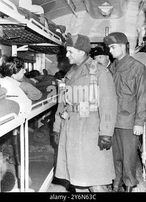 Korea: Lt Gen. Matthew D. Bridgways Comanding general 8th U.S. Army, extends his best wished to private Donald Forbes, of Dundes, Scorland, of the 27th British Brigade,during the general'svisit aboard a United Nations hospital train, somewhere in Korea. 5 February 1951    The Korean War  from June 25, 1950 to July 27, 1953, was a conflict between North Korea and South Korea Stock Photo