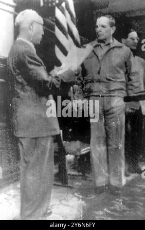 Picture taken today in Seoul showing  President Syngman Rhee decorating General MacArthur with Korean Rebublics Military Merit Order at the Seoul National Assembly Hall. 29 September 1950 Stock Photo