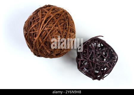 decorative wicker wooden balls on a white background Stock Photo