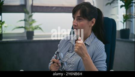 Female psychologist or psychotherapist conducts counseling session. Professional therapist discusses mental disorders, psychological problems, talks to patient. Psychological assistance. Mental health Stock Photo