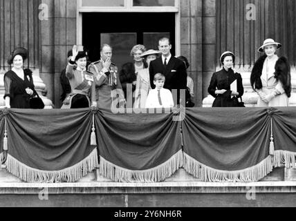 The strain of the hour long ceremony over, the Duke of Gloucester smokes a cigarette as his niece the Queen Elizabeth II waves gaily to the crowds thronging before the gates of Buckingham Palace after Trooping the Colour Left to right: the Queen Mother, the Queen, the Duke of Gloucester, the Marchioness of Carlsbrooke, the Princess Royal the Duke of Edinburgh and in front Prince Richard of Gloucester, Princess Margaret and Lady Patricia Ramsey  June 5th 1952 Stock Photo