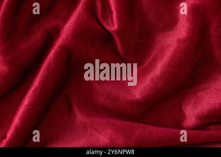 Red velvet textile folded fabric for background. Top view. Stock Photo