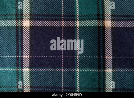 Green and blue tartan checkered textile fabric for background. Top view. Stock Photo