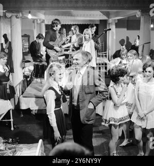 Actress Portland Mason with her famous father actor James Mason during a break in Portlands film The Great St Trinians Train Robbery at Shepperton Studios. Mr Mason dropped in to the film set to visit his daughter taking time off from the filming of Georgy Girl Portland plays a sixth form pupil named Georgina  29th November 1965 Stock Photo