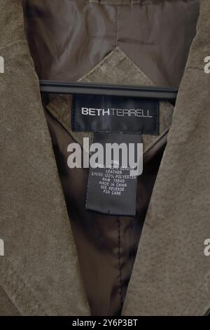 Designer Beth Terrell Olive Green Suede Jacket Labels Stock Photo